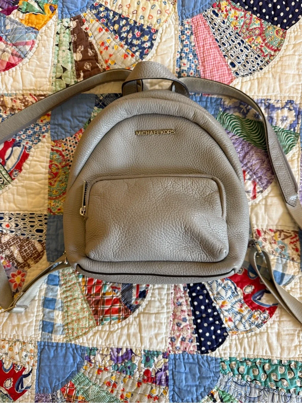 Michael Kors Pebbled Leather Mini Backpack in Light Gray with Gold Hardware